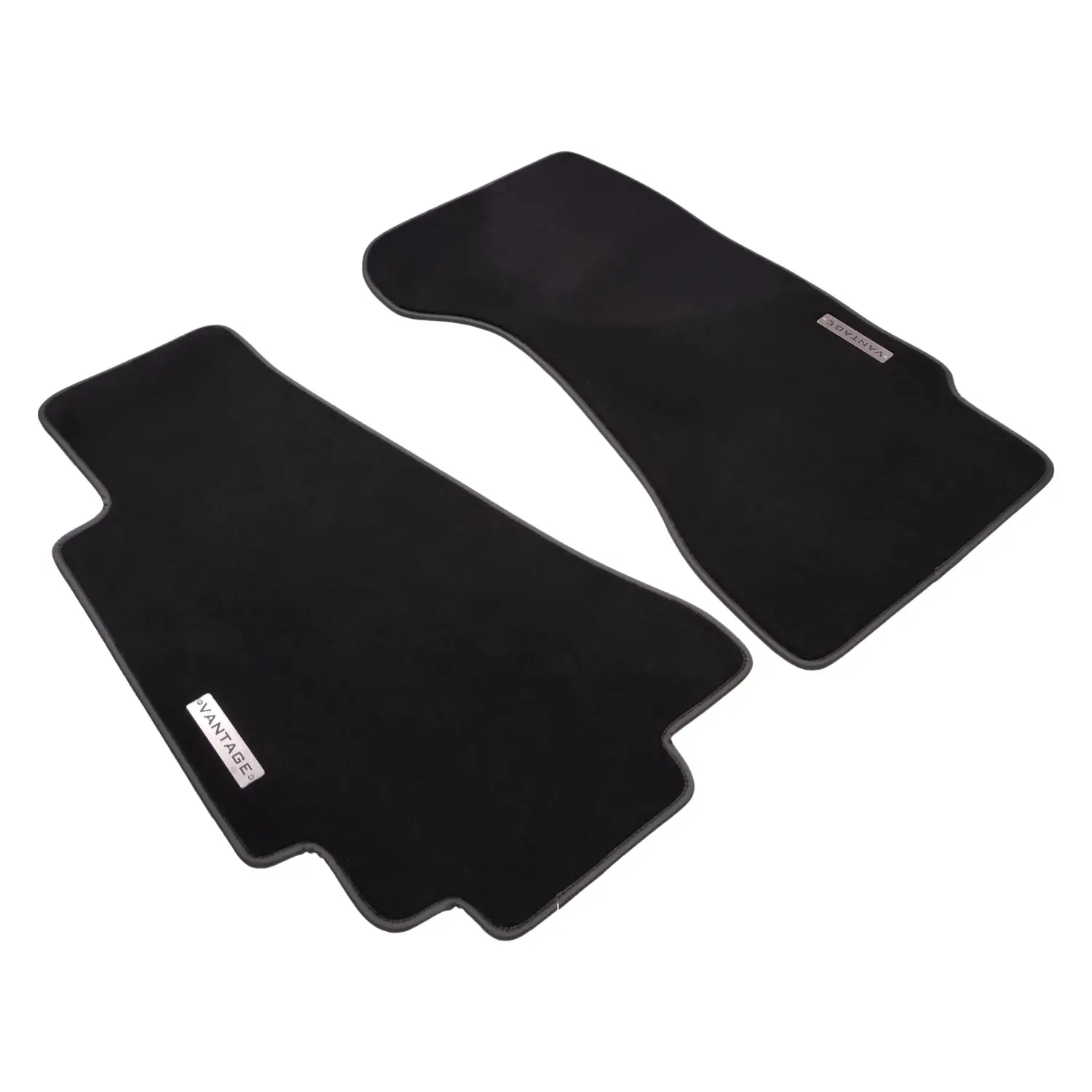 Bespoke black velour floor mats for Aston Martin Vantage (2005-2018) featuring metal "Vantage" logos.