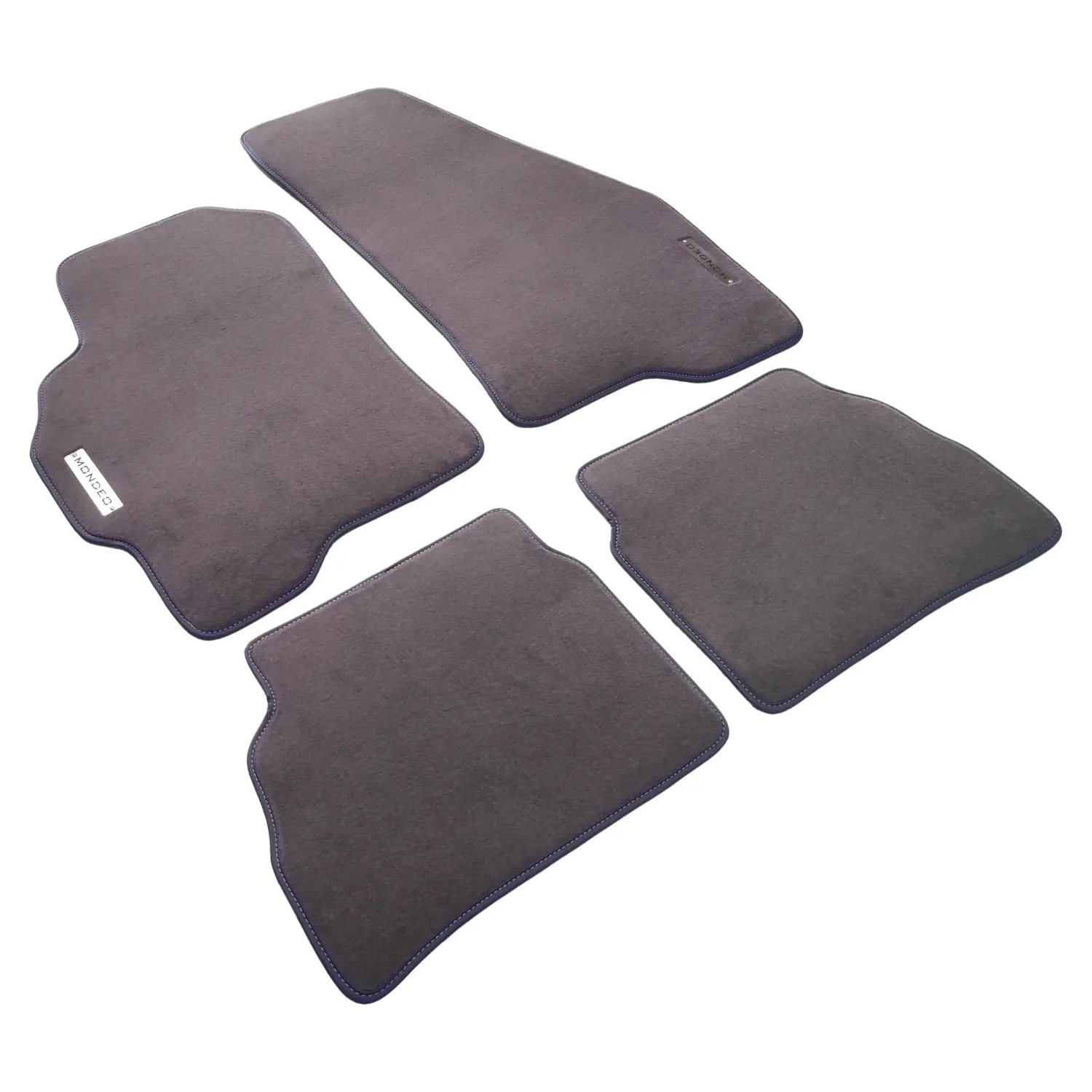 Custom 4-piece gray carpet floor mat set for Ford Mondeo with navy blue edge trim.