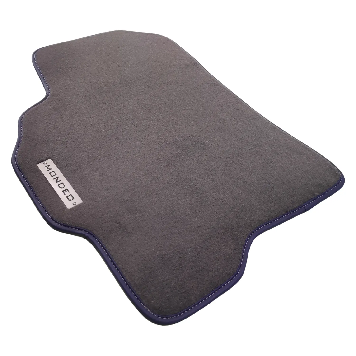 Dark gray carpet floor mat for Ford Mondeo with navy blue border stitching and metal logo